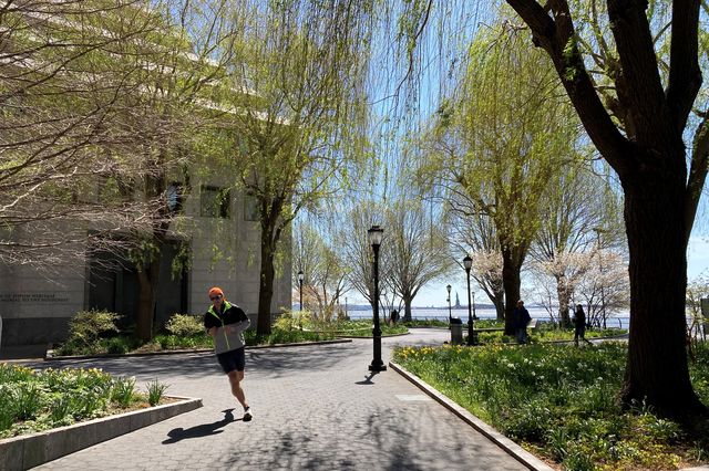 a guy jogging in Battery Park